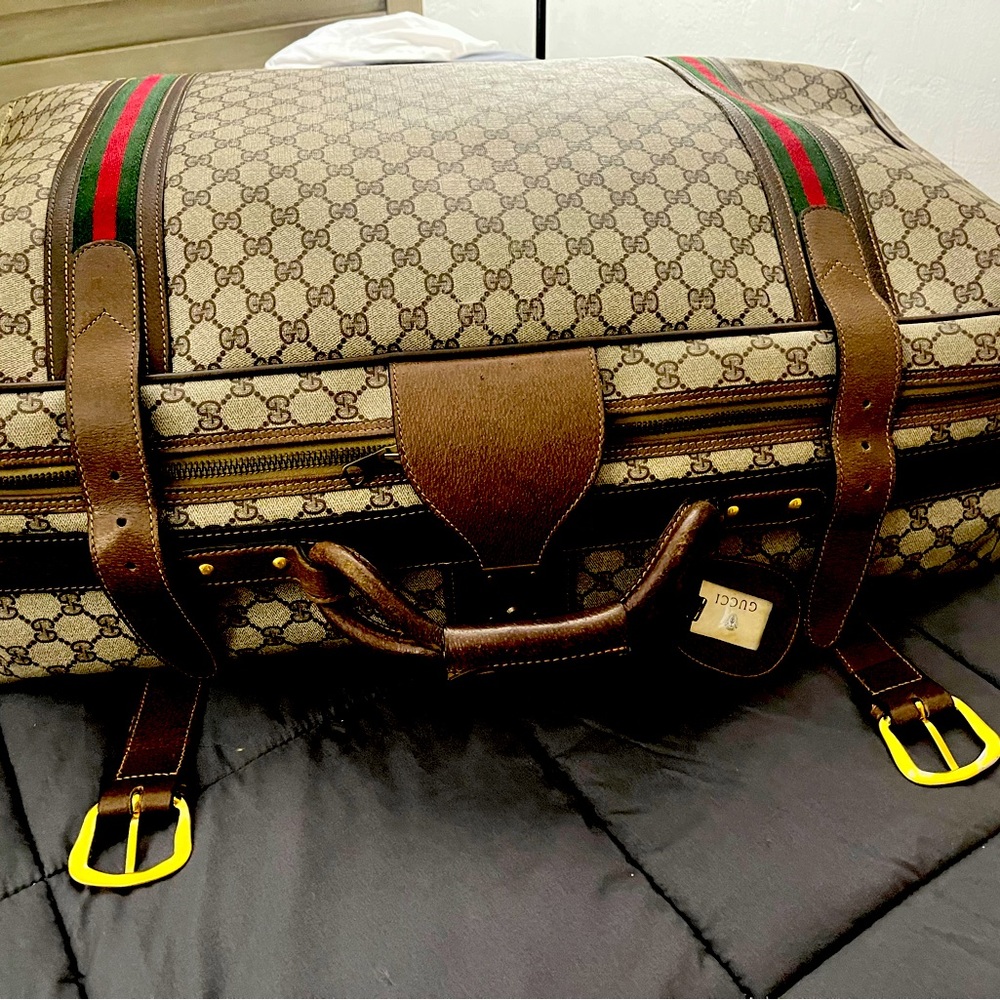 Gucci supreme leather luggage